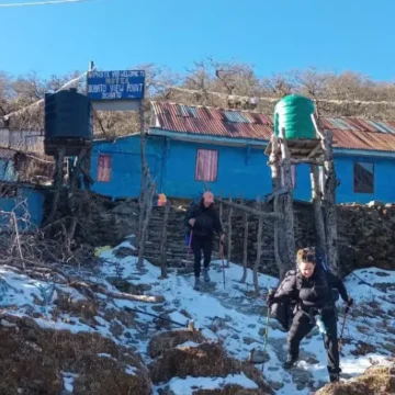 Trekkers departing from a teahouse in Dobato