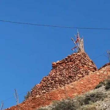 A stupa made of stone on top of the mountain