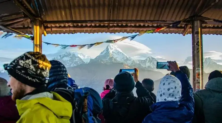 People clicking photos at Poon Hill