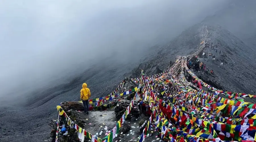 Prayer flags and trekker at Crystal Mountain