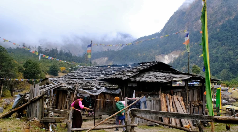 Traditional mountain flags and local house