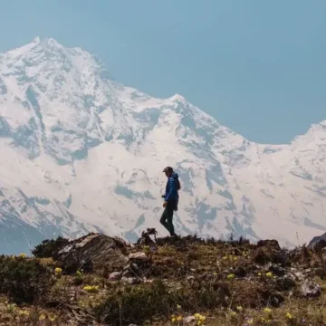 Trekker with massive mountain at the background