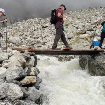 Trekkers crossing the stream at Langtang