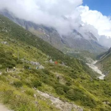 View of Langtang Valley with trekkers trekking along the Langtang River