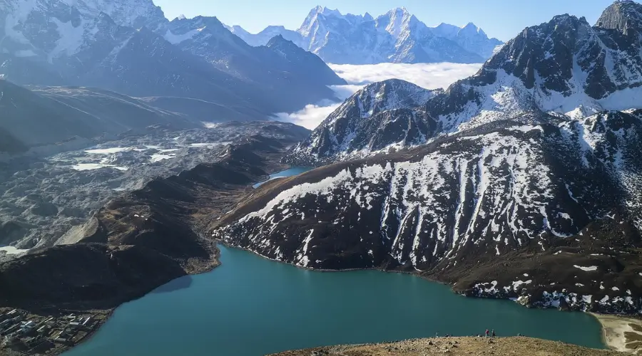 Aerial view of Gokyo Valley Lake, surrounded by majestic mountains, showcasing the serene beauty of nature.