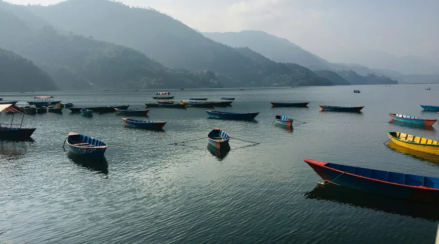 Phewa lake surrounded with lush green hills.