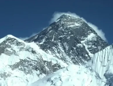 Mount Everest surrounded by other mountains