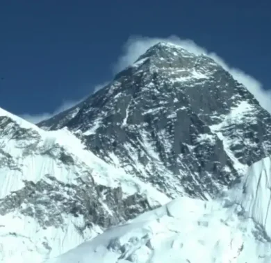 Mount Everest surrounded by other mountains