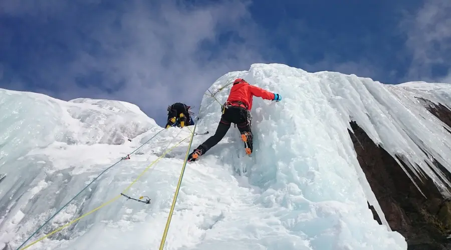 Mountaineers climbing mountain