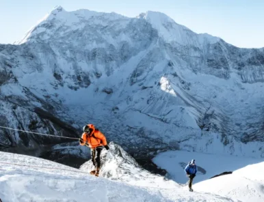 Mountaineers climbing Island Peak using ropes