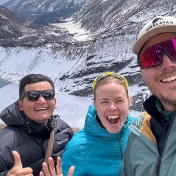 Trekkers posing at frozen Birendra Lake