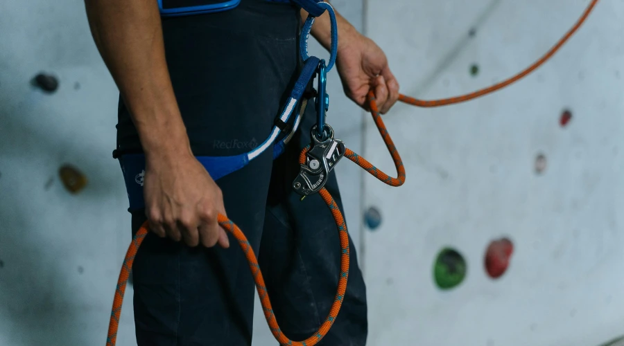 A person equipped with climbing gears