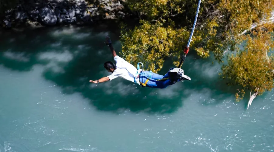 Bungee jumping over the fast flowing river