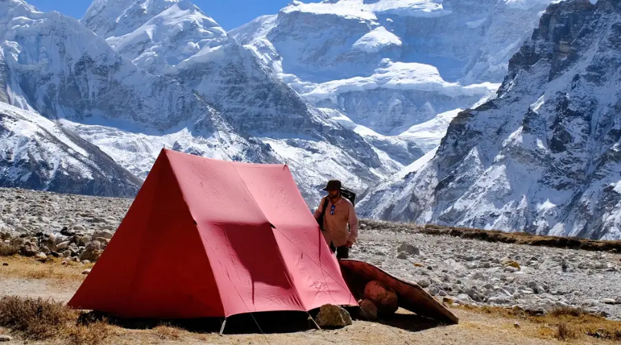 Camping in the Kanchenjunga region with a mountain view in the background