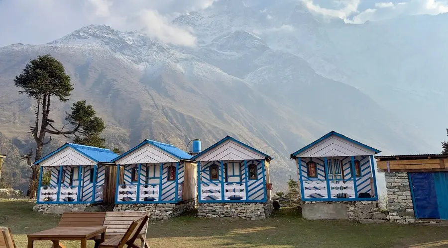 Teahouses made of wood with a mountain view in the background during horseback treks