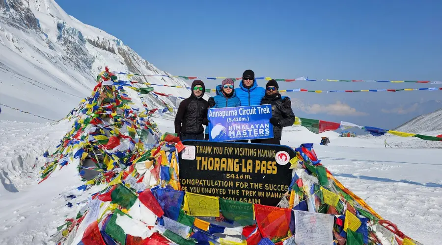 Trekkers and the Himalayan Masters team at Thorong La Pass